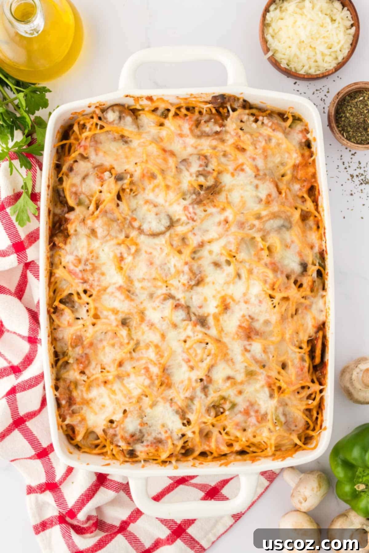 Hearty Vegetarian Spaghetti Bake 3 Close-up of a bubbling dish of vegetarian baked spaghetti fresh from the oven, showcasing melted cheese and savory sauce