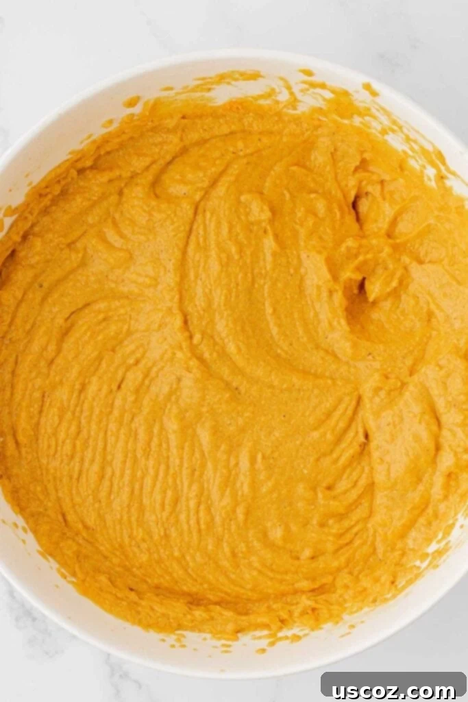 Pumpkin Cheesecake Dip 11 pumpkin cream cheese dip in a mixing bowl