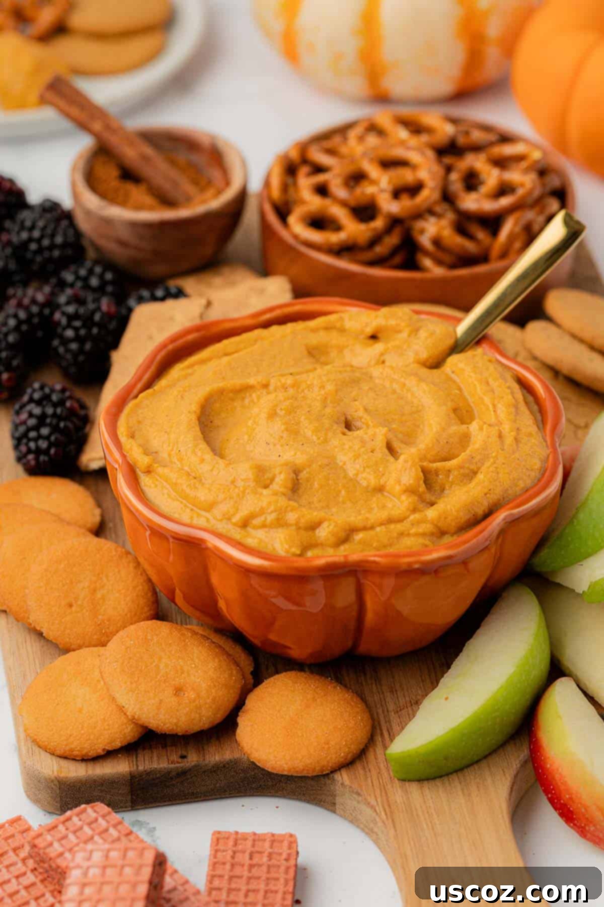 Pumpkin Cheesecake Dip 12 bowl filled with pumpkin cream cheese dip