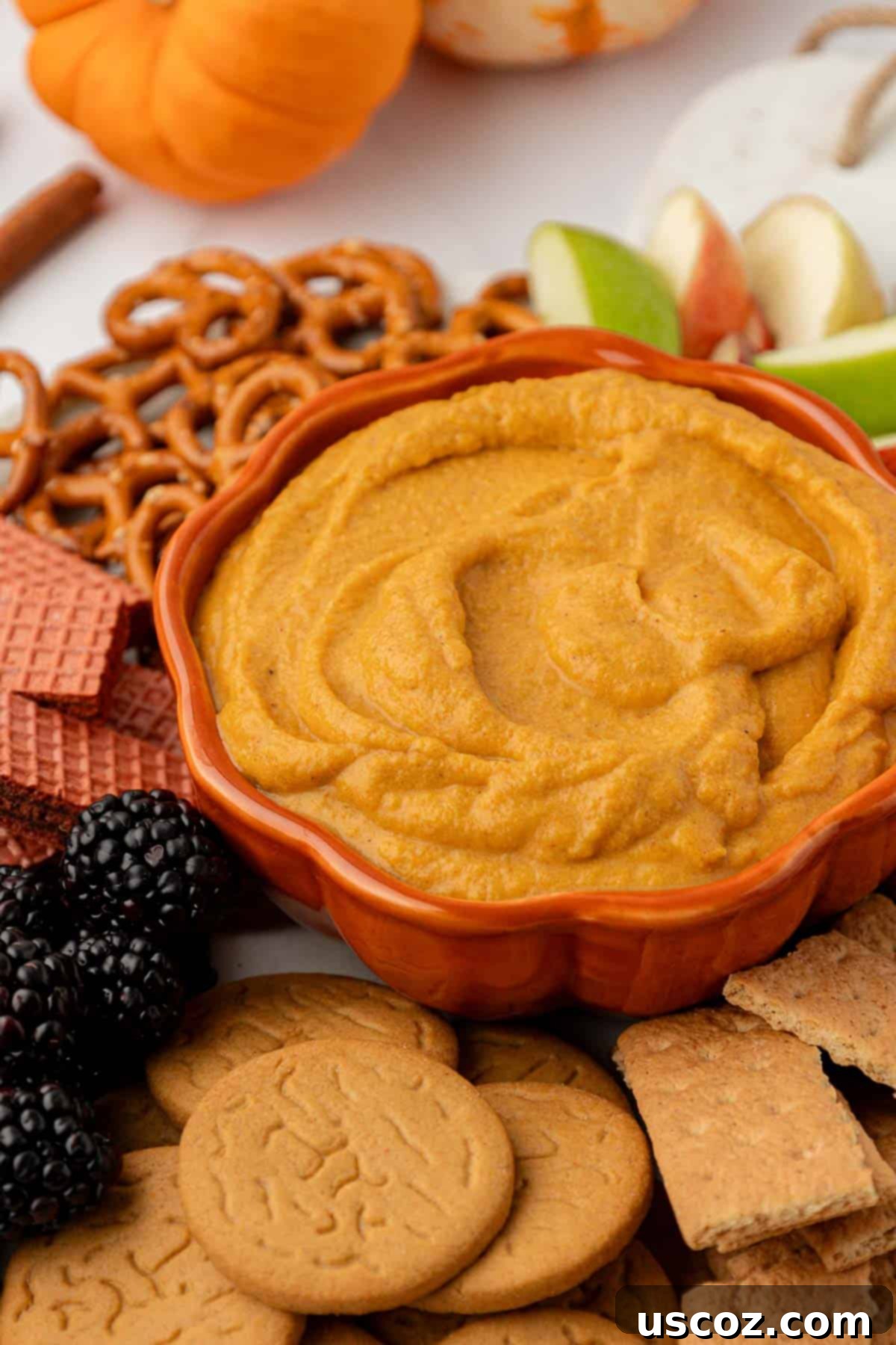 Pumpkin Cheesecake Dip 13 bowl filled with pumpkin cream cheese dip