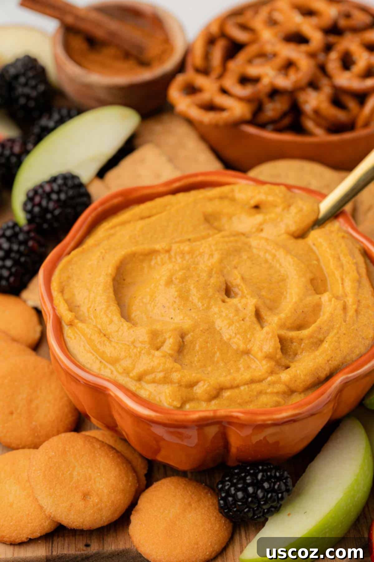Pumpkin Cheesecake Dip 16 bowl filled with pumpkin cream cheese dip