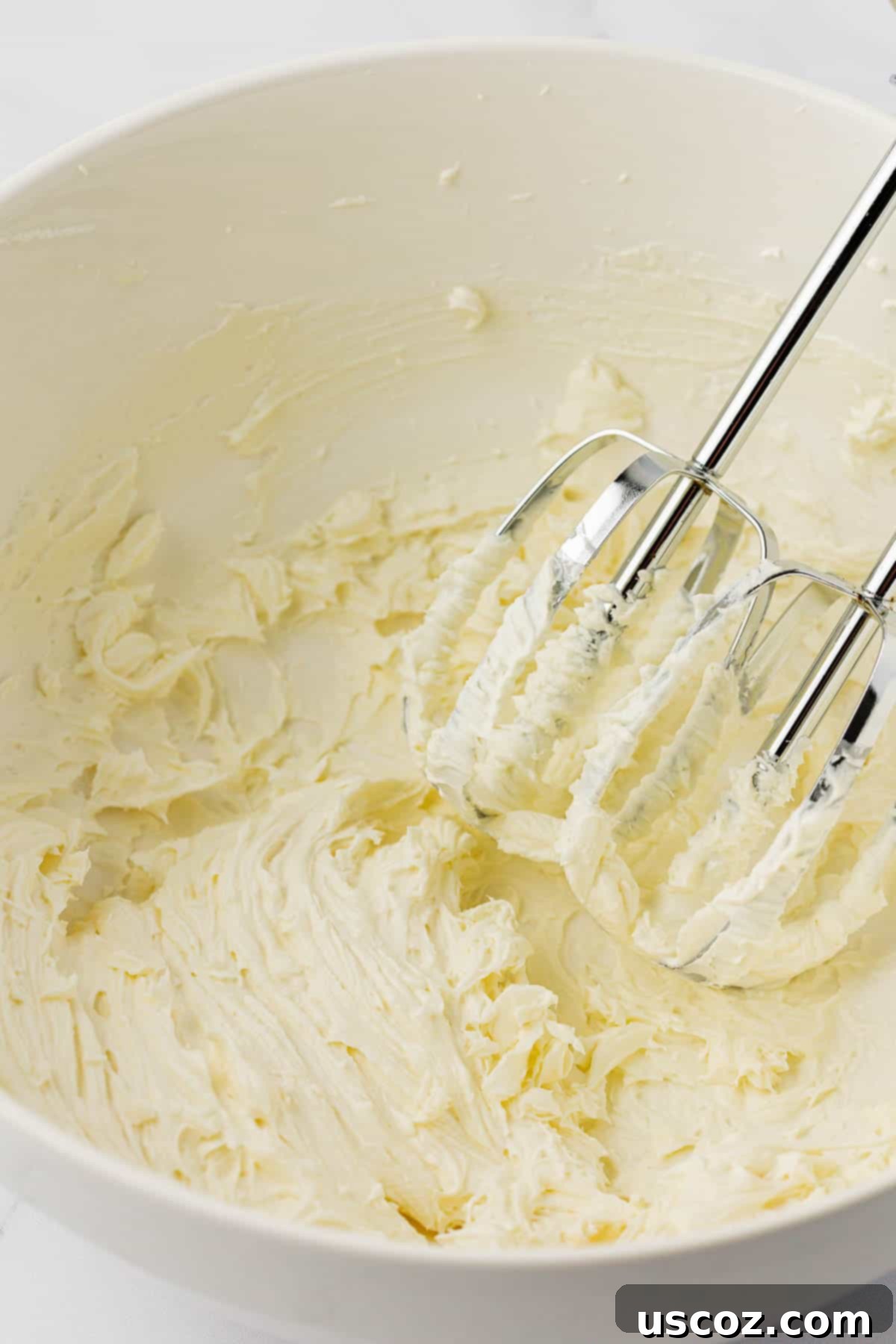 Pumpkin Cheesecake Dip 5 cream cheese whipped together in a mixing bowl