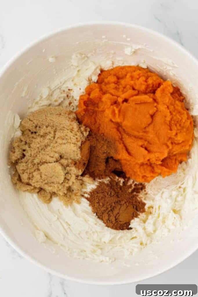 Pumpkin Cheesecake Dip 6 adding the pumpkin, spices, and brown sugar to the cream cheese
