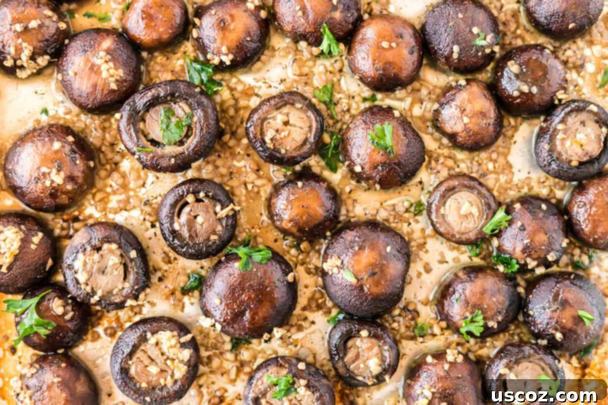 75 Delicious Vegetarian Meals 3 roasted garlic mushrooms on a baking sheet