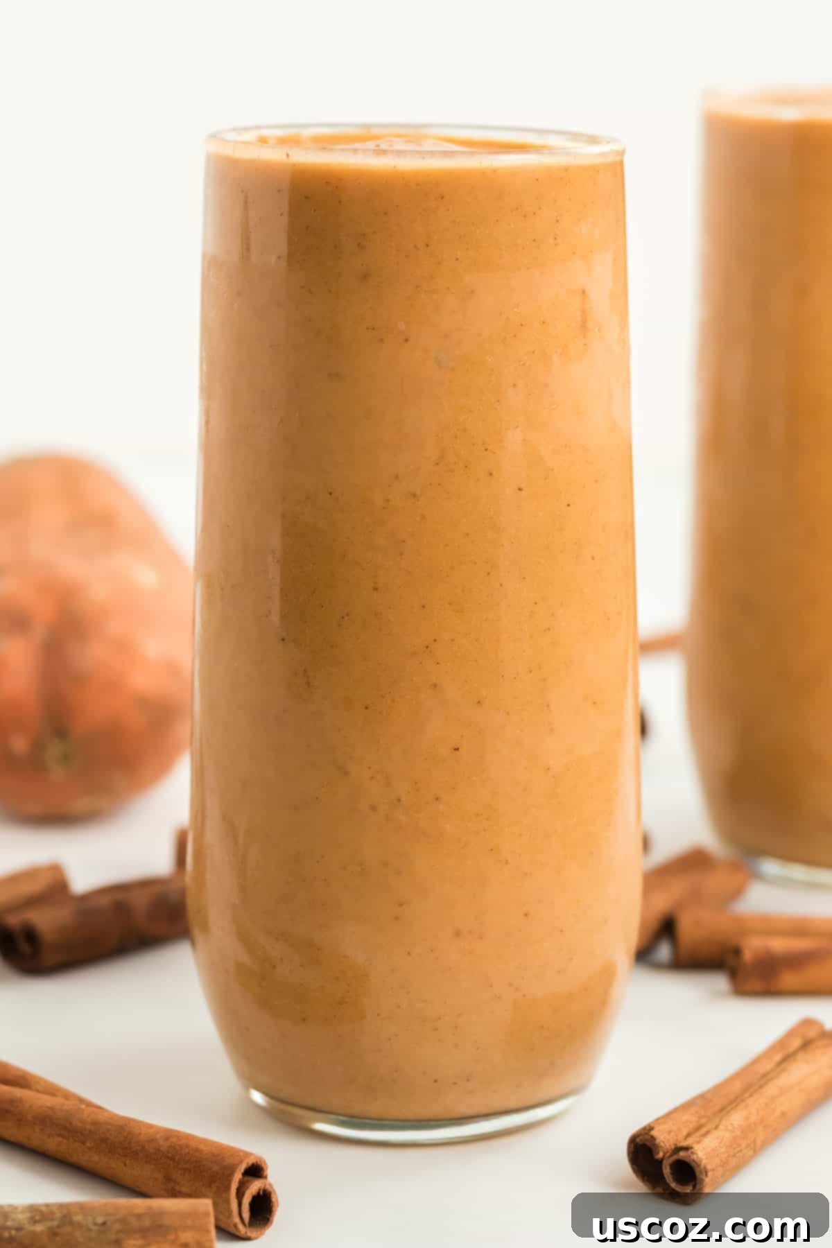 tall glass filled with sweet potato smoothie