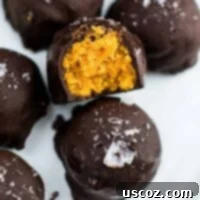 Bittersweet Pumpkin Spice Truffles 11 pumpkin truffles on a plate