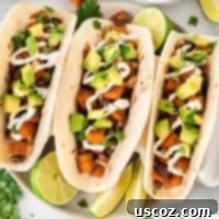Sweet Potato Perfection: 15 Vegetarian Recipes 5 sweet potato tacos topped with sour cream and diced avocado