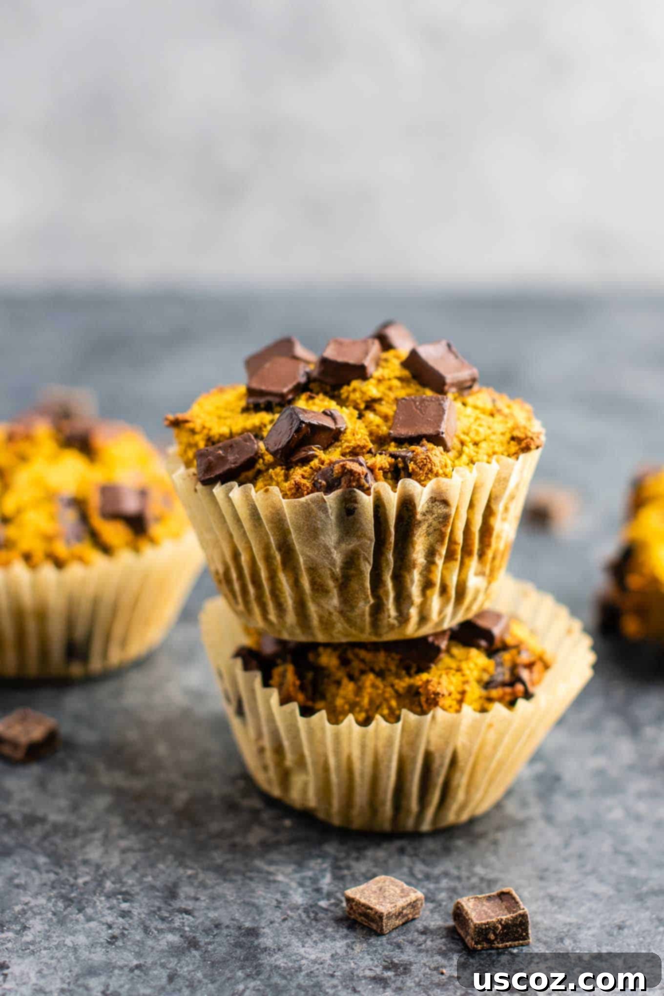 Perfectly Spiced Gluten-Free Pumpkin Muffins 3 Gluten free pumpkin muffins with dark chocolate chips stacked