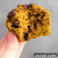 Perfectly Spiced Gluten-Free Pumpkin Muffins 7 holding a gluten free pumpkin muffin