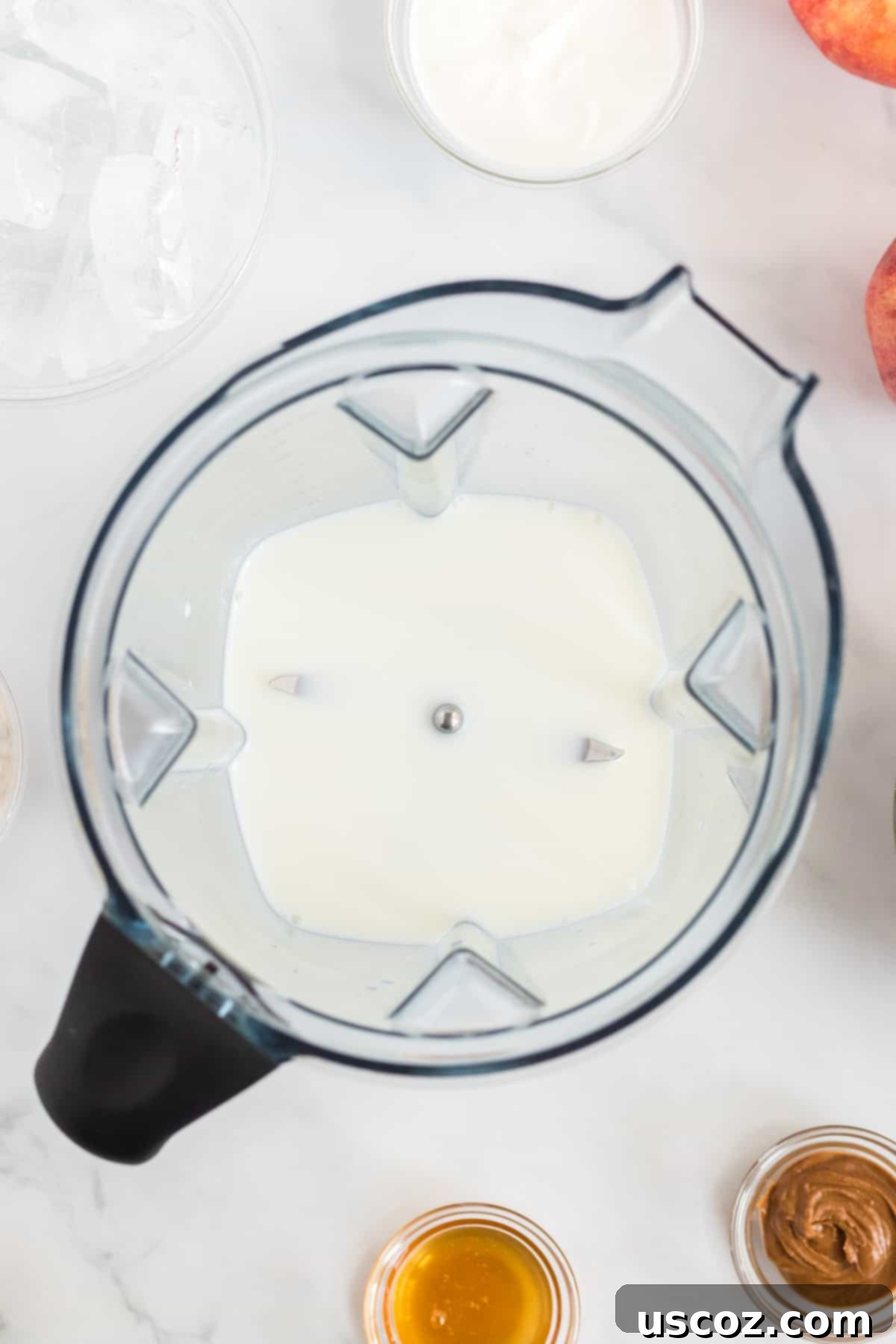Liquid Apple Pie 4 Milk being poured into a blender, the first step for making a creamy apple pie smoothie