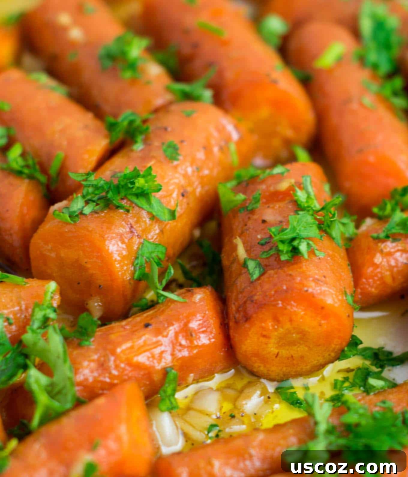 36 Delicious Vegetarian Thanksgiving Dishes 17 Roasted garlic carrots in a serving dish, caramelized and tender