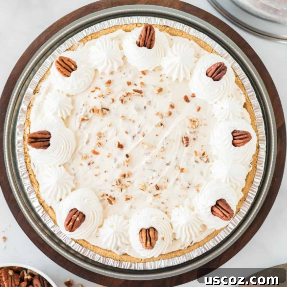 36 Delicious Vegetarian Thanksgiving Dishes 33 Pecan cream pie elegantly decorated with whipped cream and whole pecans on top