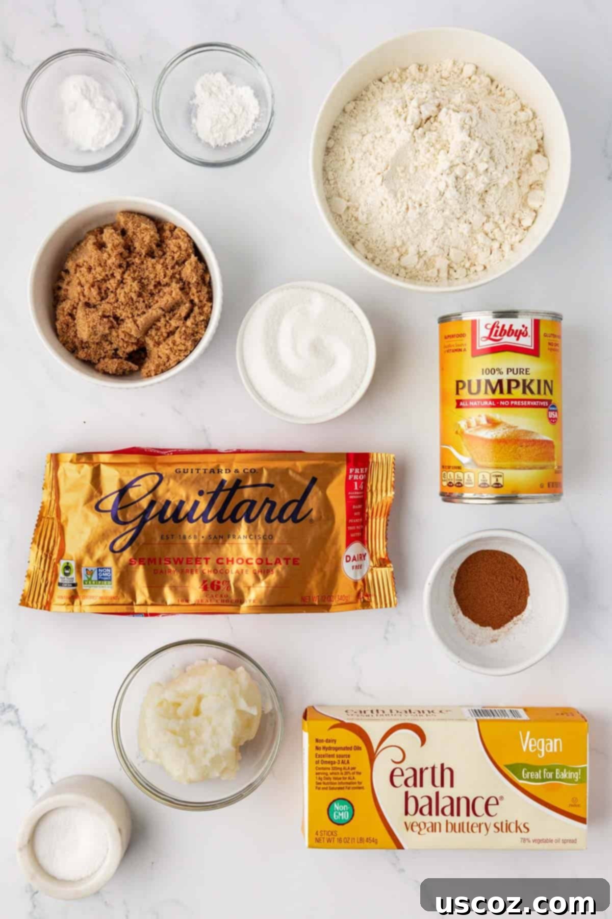 Cozy Vegan Pumpkin Chocolate Chip Cookies 4 A flat lay showing all the essential vegan pumpkin chocolate chip cookie ingredients: flour, sugars, spices, pumpkin puree, vegan butter, coconut oil, and dairy-free chocolate chips.