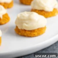 Soft and delicious gluten-free pumpkin cookies with a creamy frosting, perfect for fall flavors.