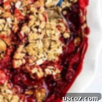 Easy strawberry crisp recipe (gluten free + vegan) – perfect for using up fresh strawberries! A healthy, dairy-free dessert that tastes amazing.