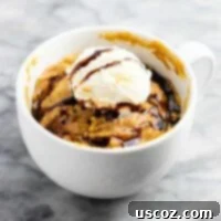 Microwave peanut butter cookie in a mug – gluten free, dairy free, and refined sugar free! This tastes amazing and is so good with ice cream! A perfect quick dessert or mug cake.