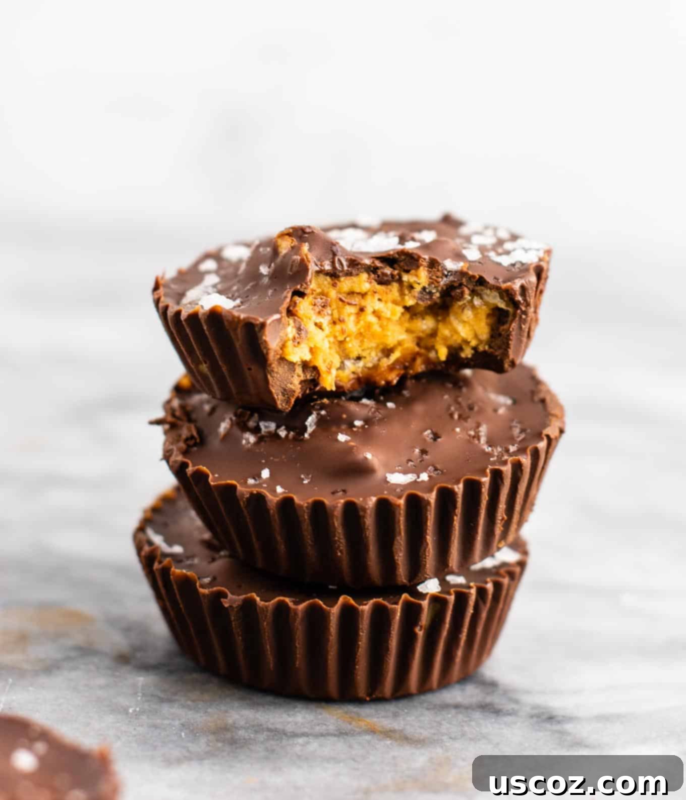 Chocolate peanut butter crunch cups with flaked sea salt – these are next level DELICIOUS! Vegan, gluten free, and tastes so good you won’t want to share! Perfect treat to keep in the freezer! #vegan #glutenfree #dessert #reesescups #vegandessert #glutenfreedessert #christmas #holidaytreat #seasalt