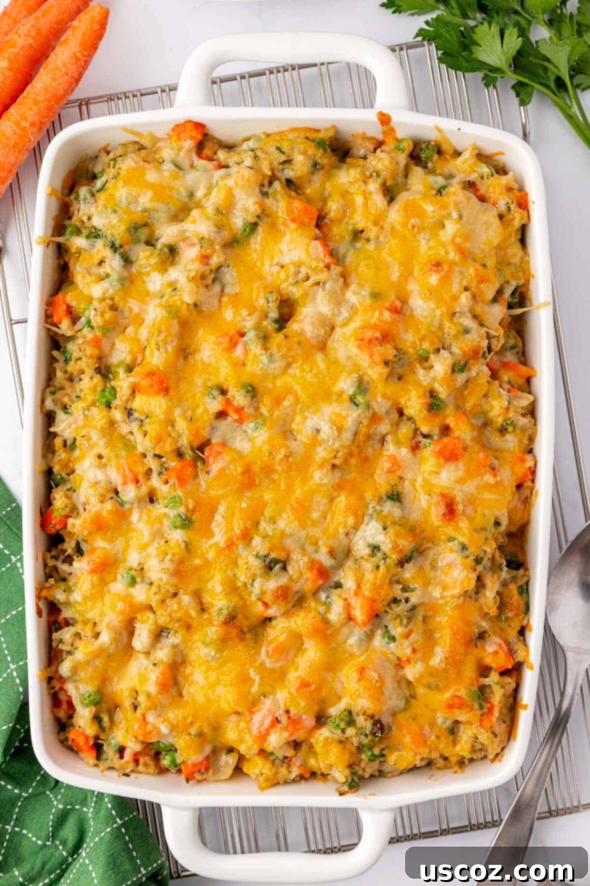 Hearty Veggie Rice Bake 14 Unbaked vegetable rice casserole in a dish, topped with cheese