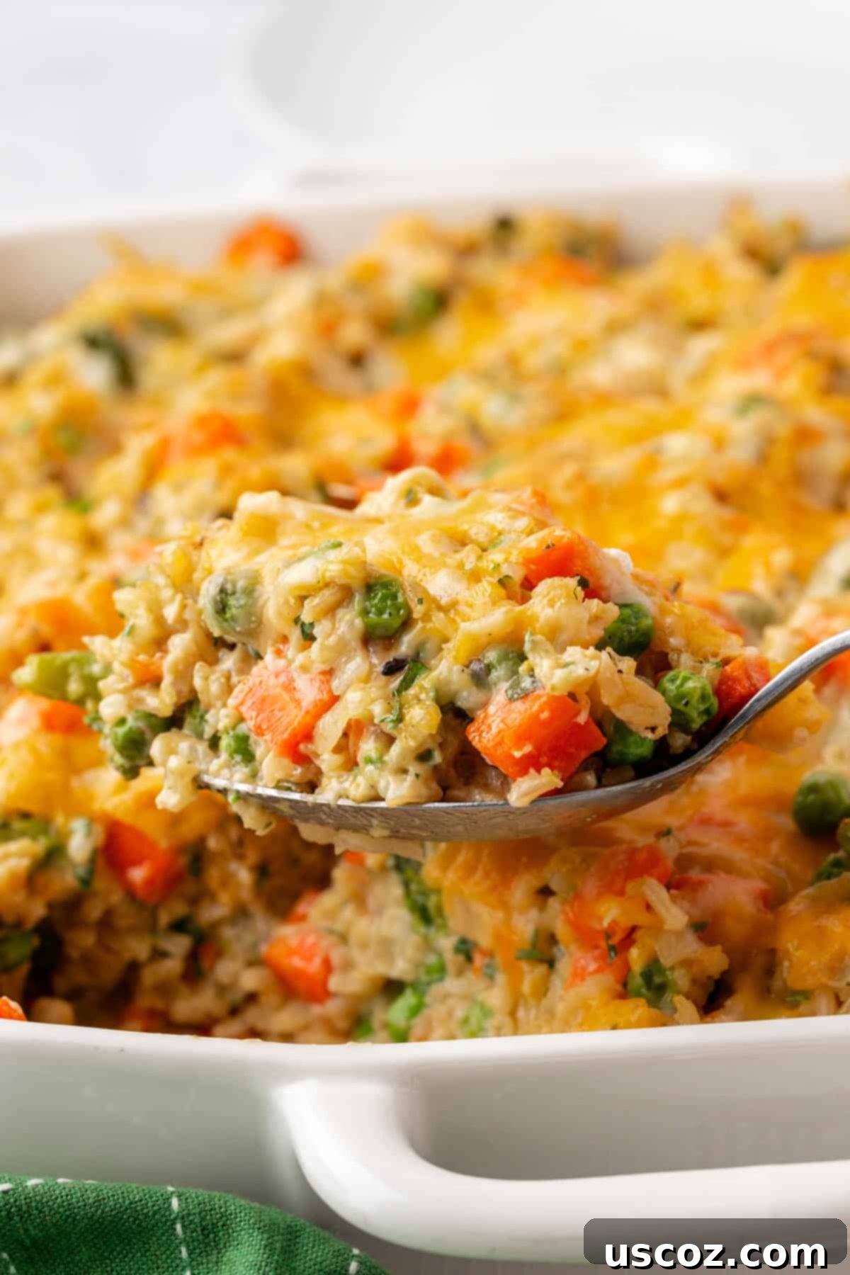 Hearty Veggie Rice Bake 18 A large serving of hot vegetable rice casserole in a white dish