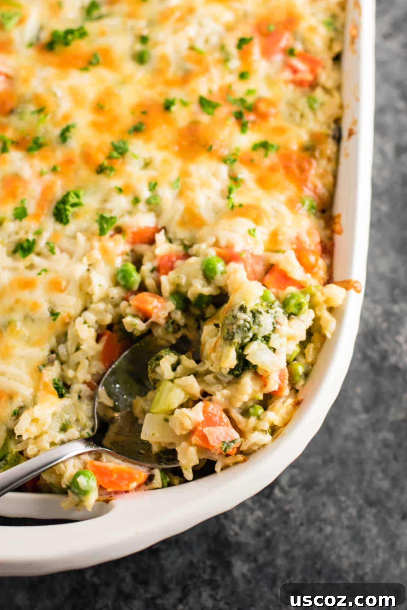 Hearty Veggie Rice Bake 20 Large dish of freshly baked rice and vegetable casserole, golden brown and bubbly