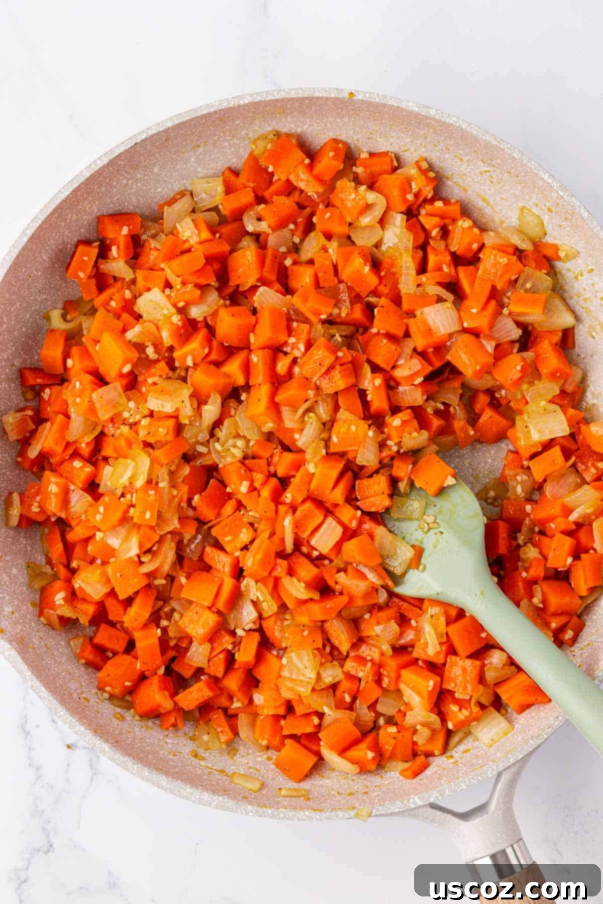 Hearty Veggie Rice Bake 6 Slightly softened carrots and translucent onions in a skillet