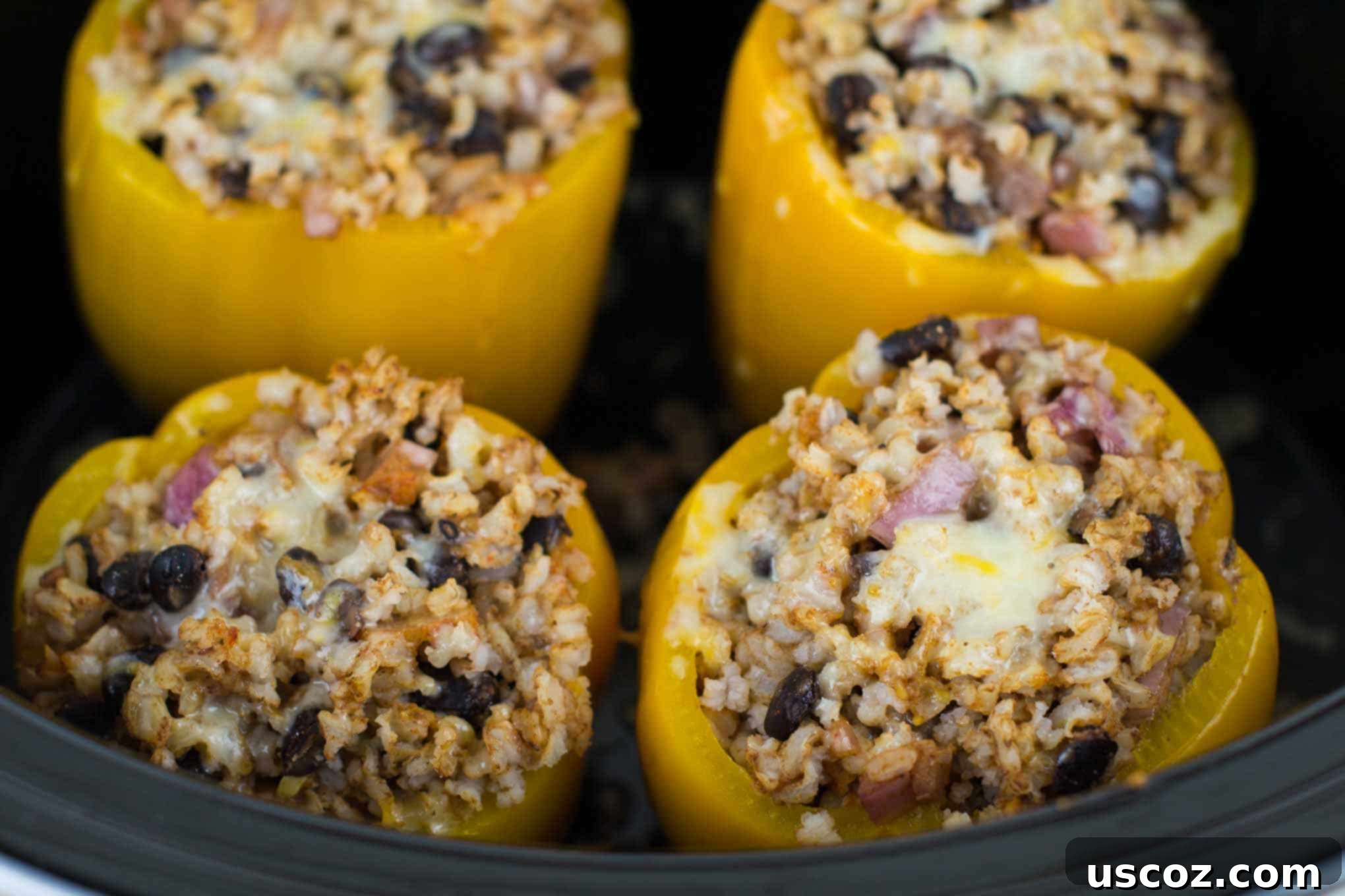 Close-up of melted cheese topping on a vegetarian crockpot stuffed pepper