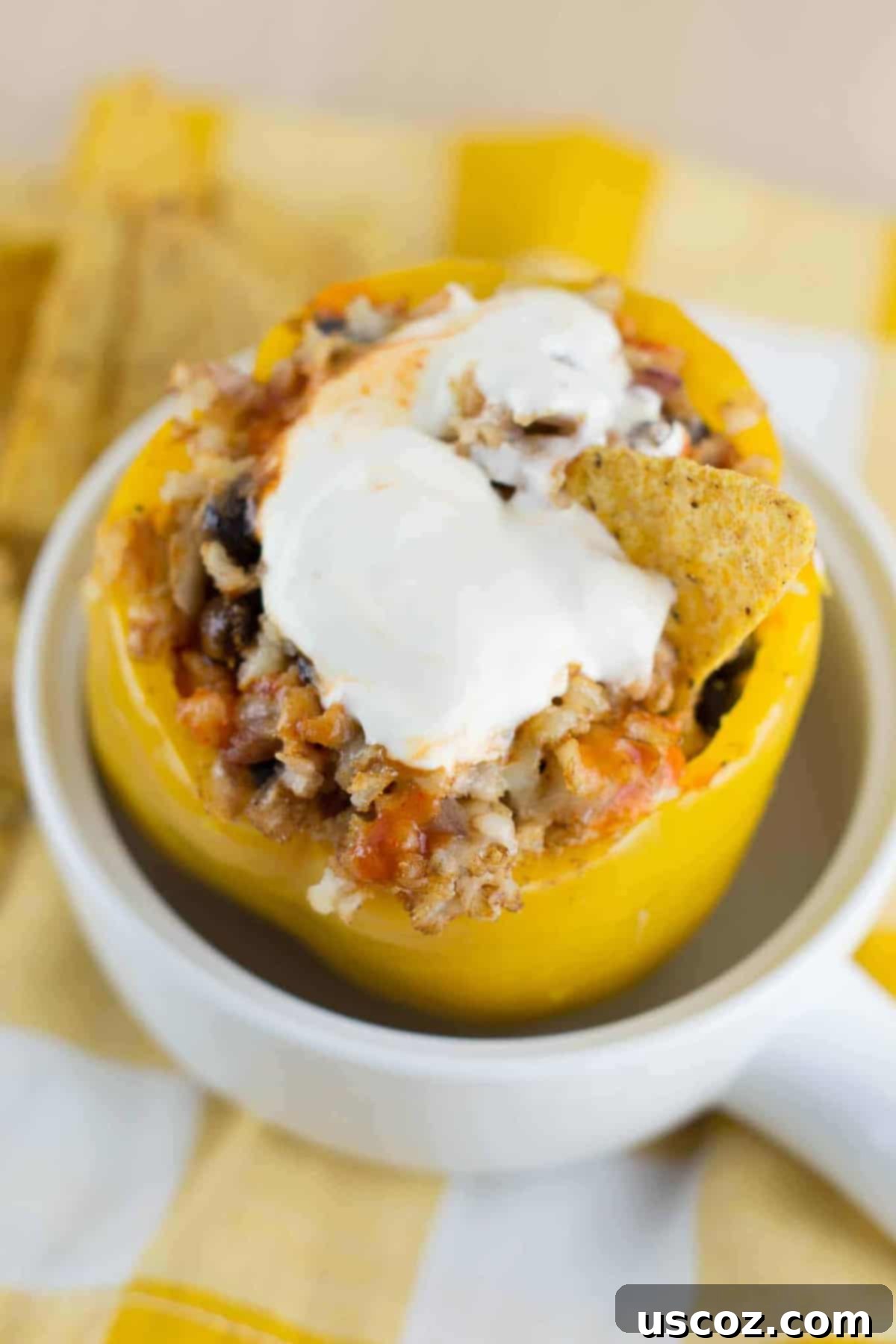 Delicious Easy Vegetarian Crockpot Stuffed Peppers with melted cheese, ready to serve