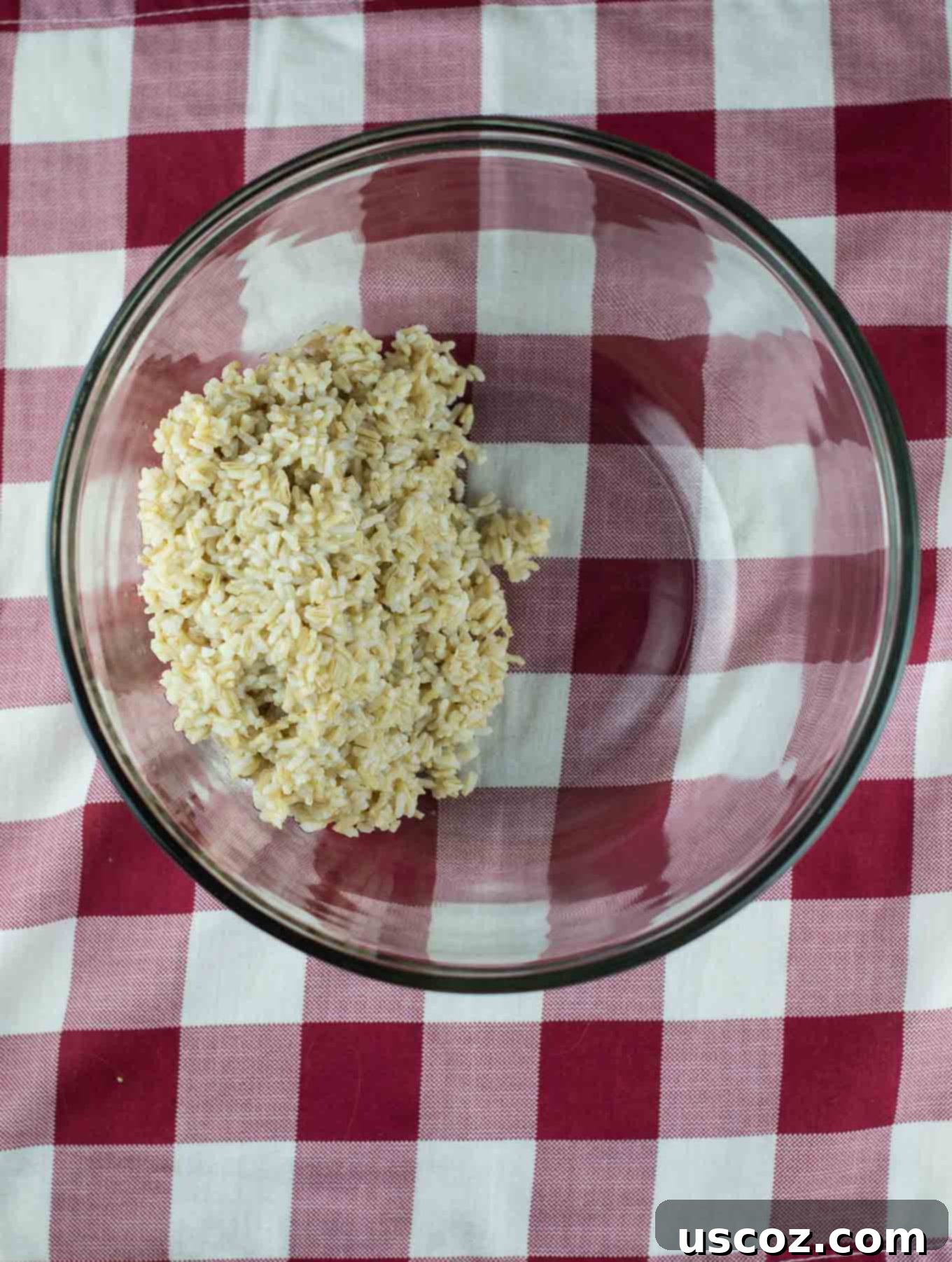 Four large bell peppers positioned upright in a slow cooker, ready for filling
