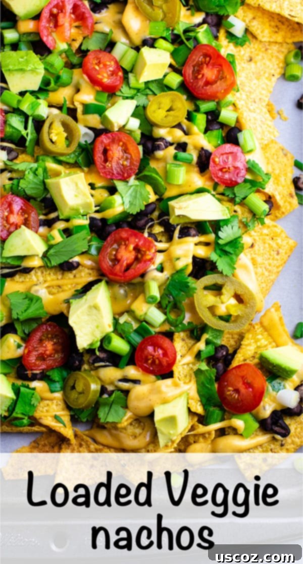 Epic Plant-Based Nachos 10 Loaded veggie nachos topped with homemade nacho cheese sauce. These are amazing! #veggienachos #vegetarian #nachocheese #nachocheesesauce