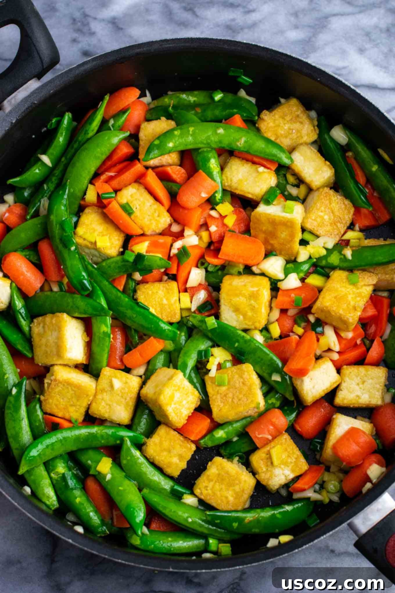 Vibrant Tofu Noodle Stir-Fry 6 Cooked stir fry rice noodles ready to be added to the skillet with other ingredients.