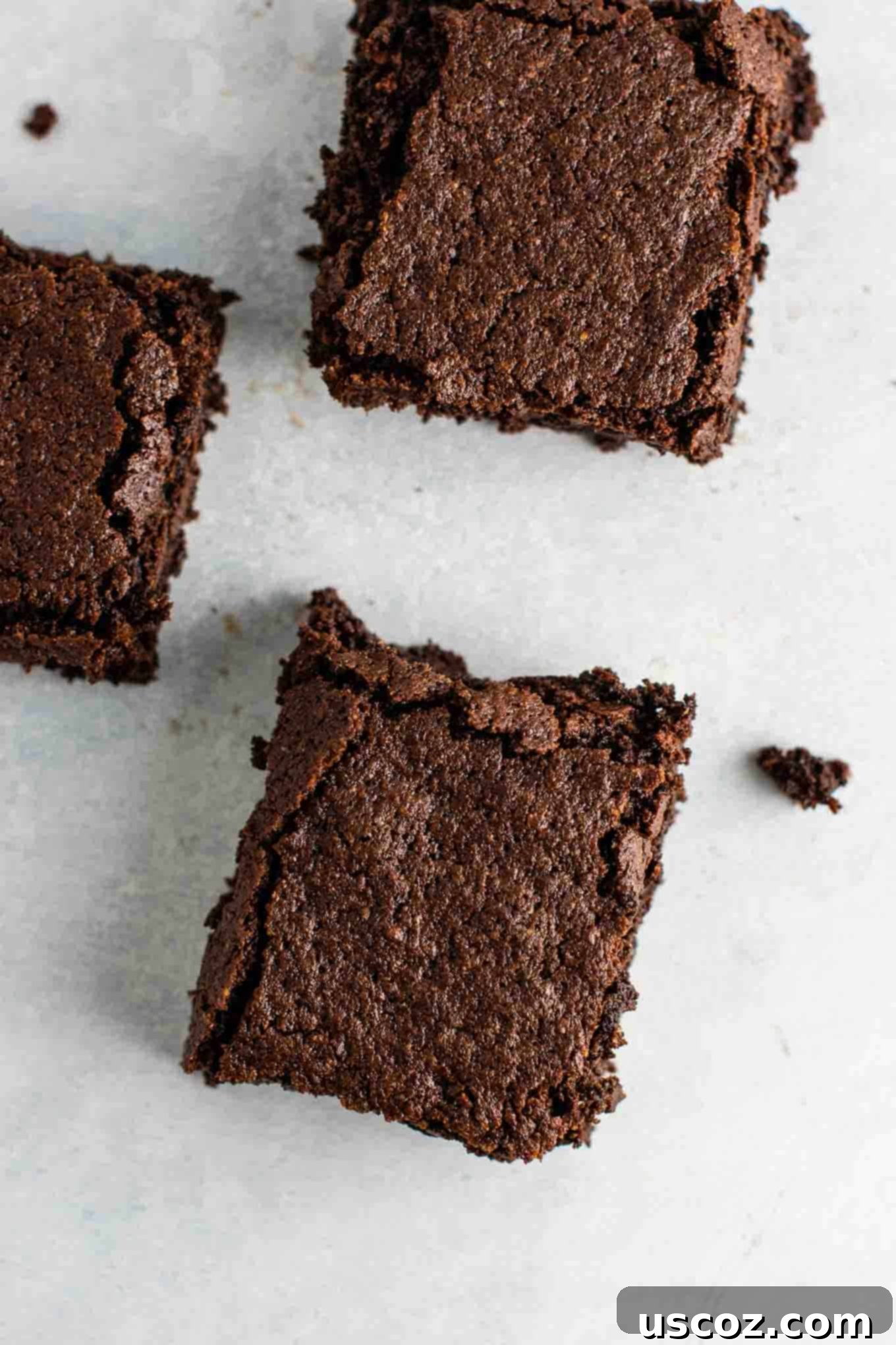 Perfectly sliced fudgy gluten-free dairy-free brownies on a cooling rack, ready to enjoy.