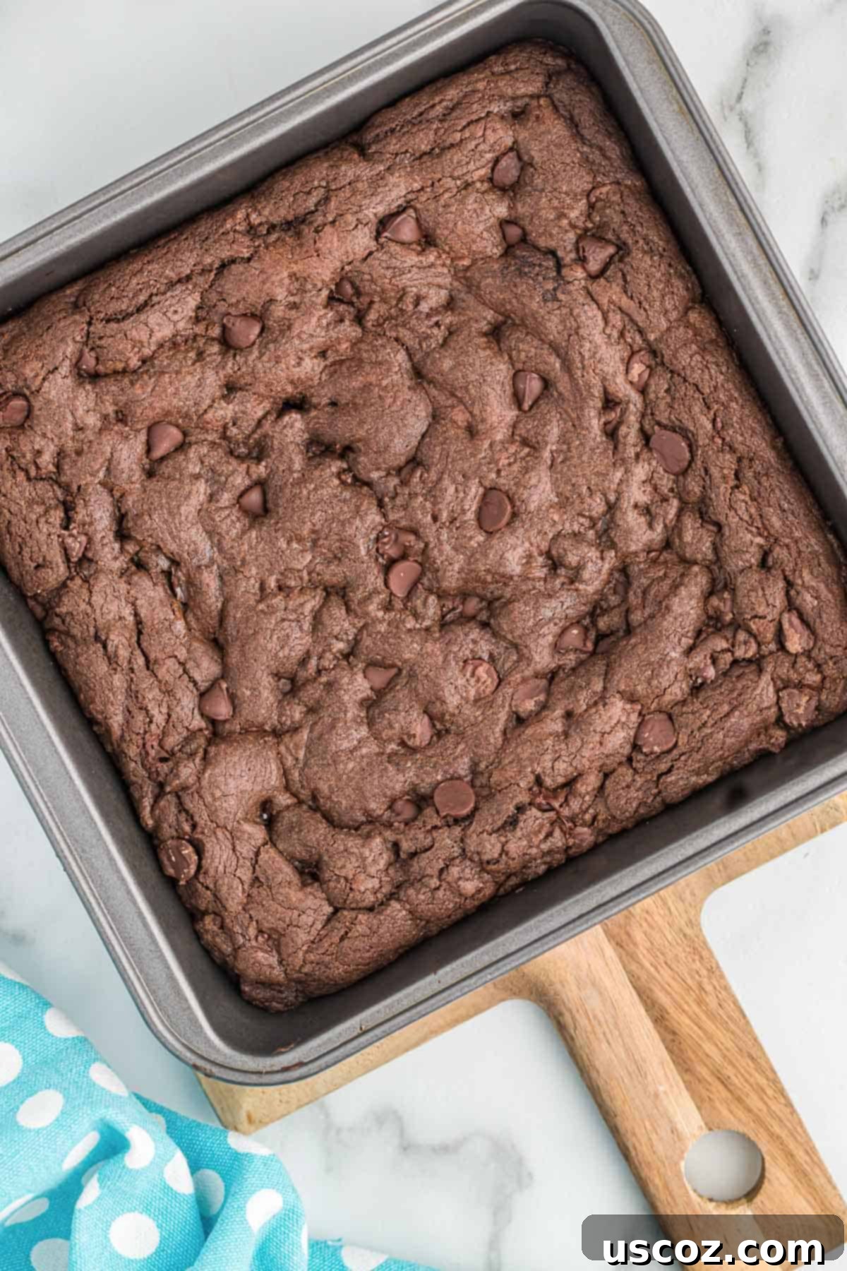 Easy Cake Mix Brownies 13 Freshly baked cake mix brownies cooling in the pan, showing their glossy top.