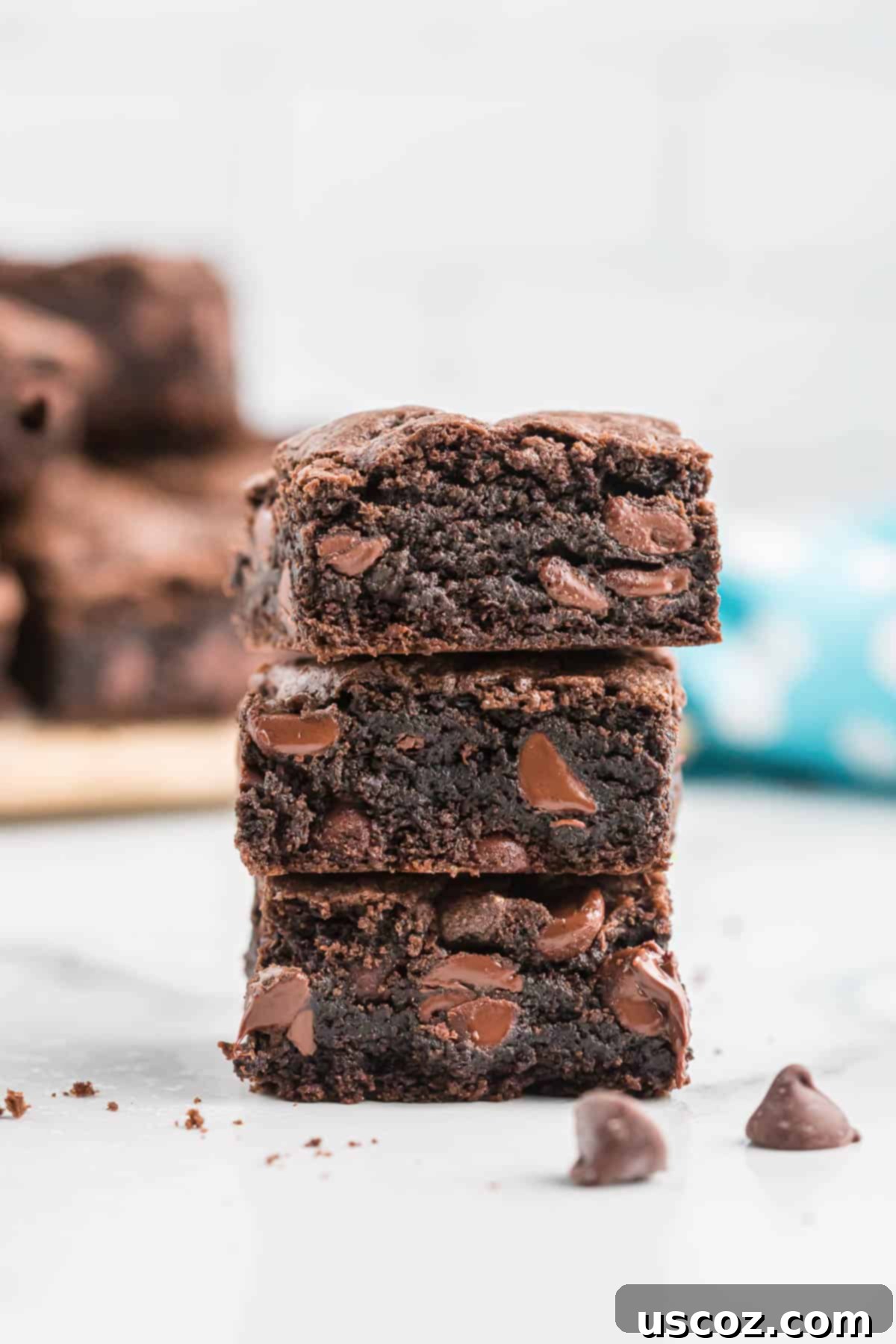 Easy Cake Mix Brownies 8 A stack of delicious cake mix brownies, ready to be enjoyed.