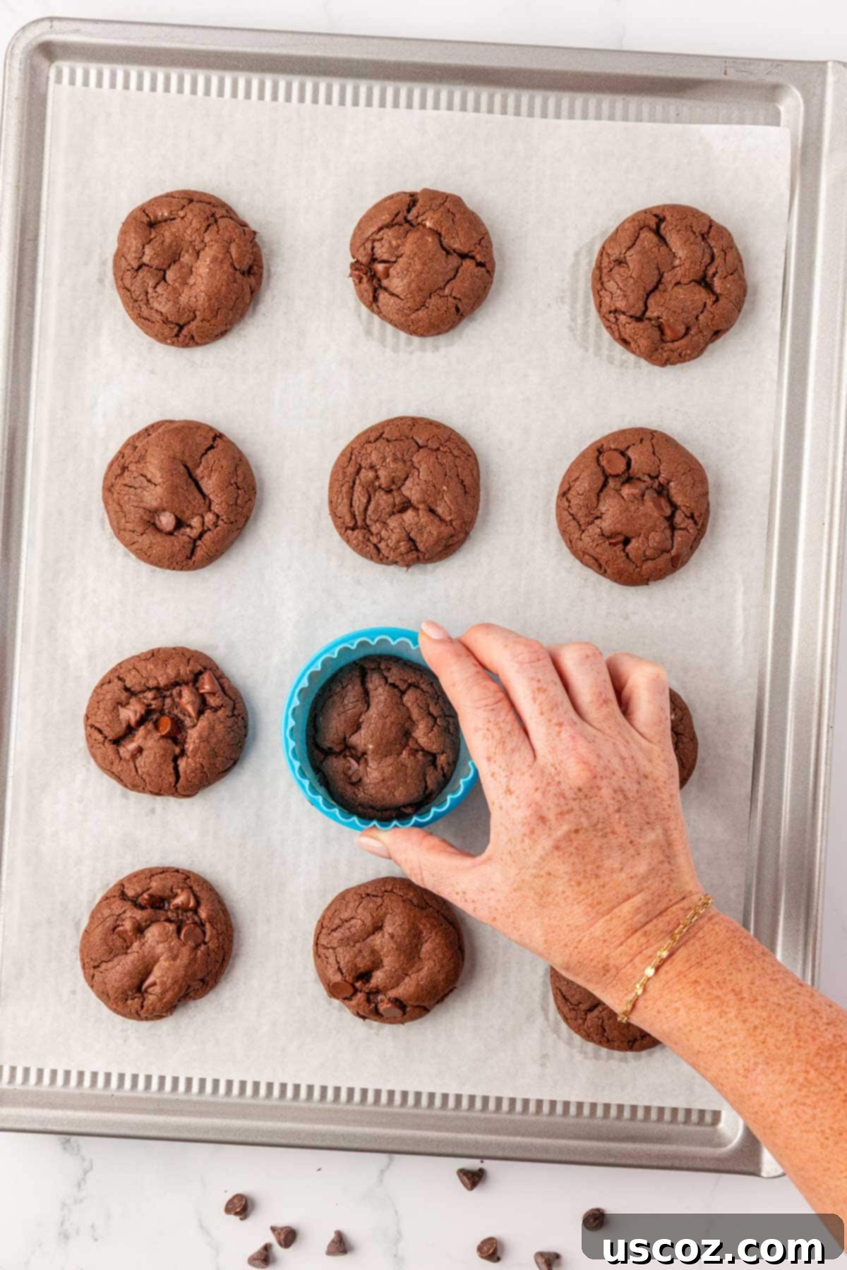 Decadent Chocolate Cake Mix Cookies 12 smoothing the edges of freshly baked cookies with a round cutter for a perfect shape