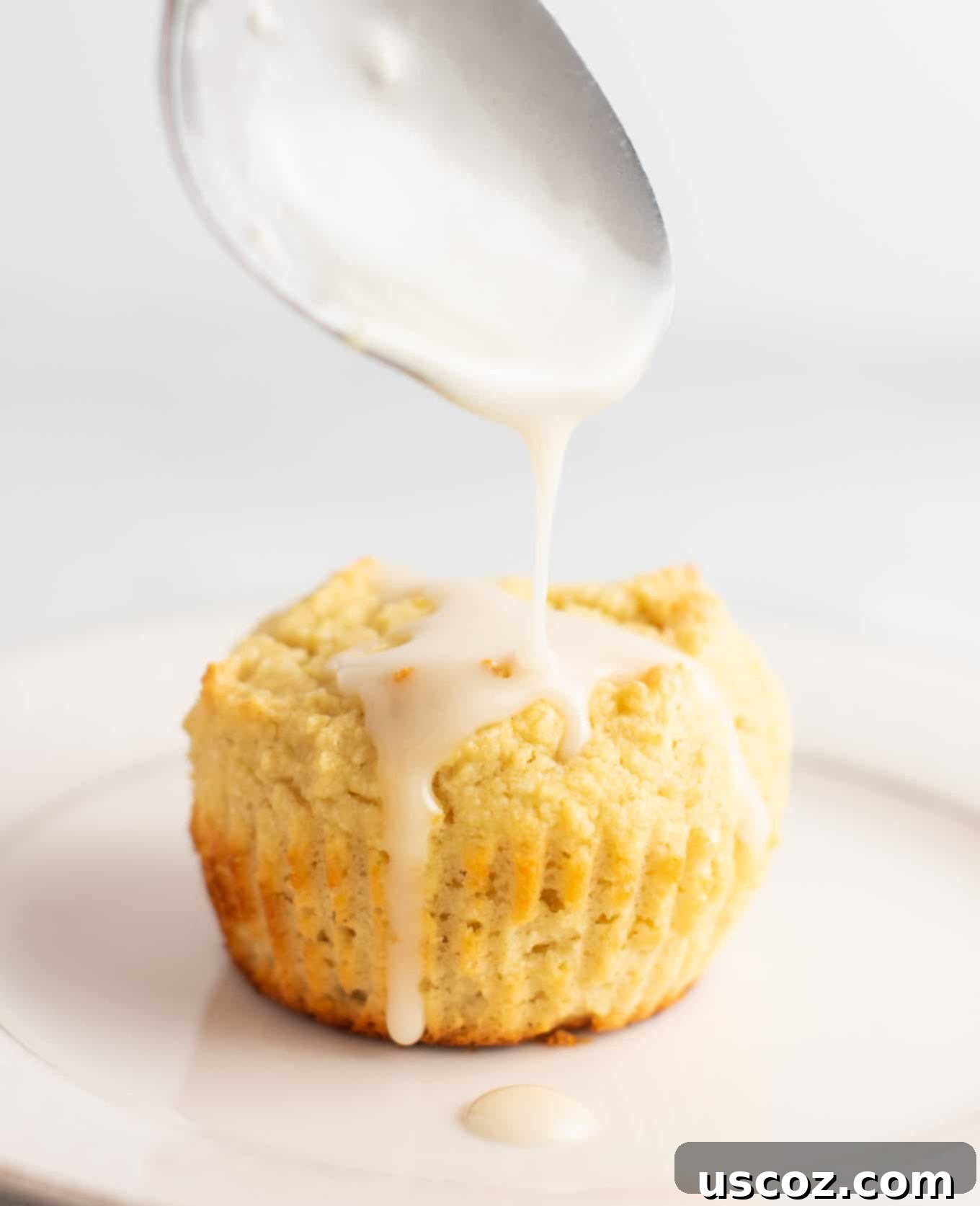 Zesty Gluten Free Lemon Muffins 3 Basket of gluten-free lemon muffins topped with a sweet lemon glaze, showcasing their perfect texture and inviting golden-brown tops. #glutenfree #lemonmuffins #breakfast