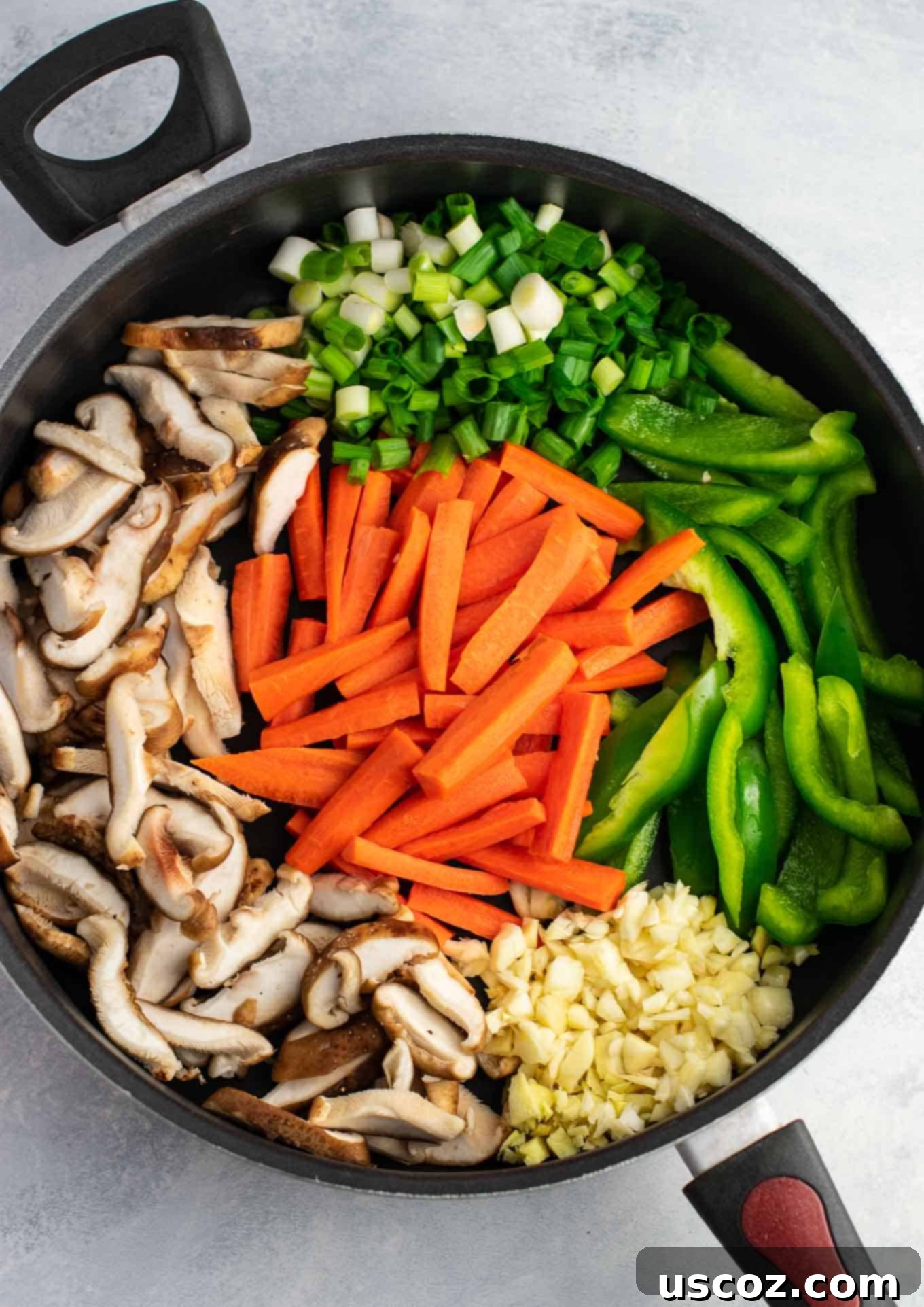 Sizzling Ramen Stir-Fry 5 Ramen noodle stir fry with golden oak shiitake mushrooms, sugar snap peas, green bell pepper, carrots, green onions, and fresh garlic and ginger in a large skillet.