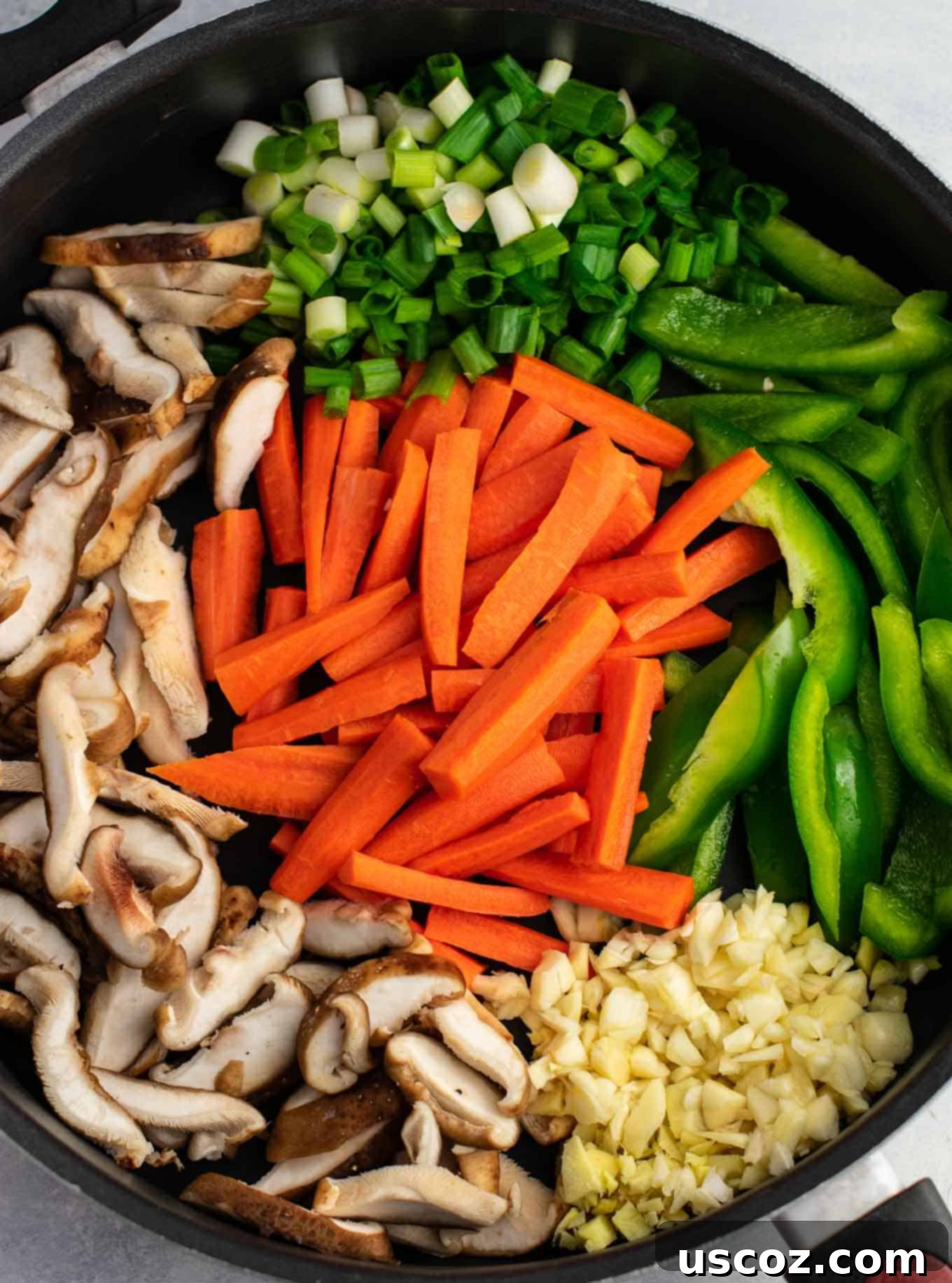 Sizzling Ramen Stir-Fry 6 Stir-frying golden oak shiitake mushrooms, sugar snap peas, green bell pepper, carrots, green onions, and fresh garlic and ginger for a ramen noodle stir fry.