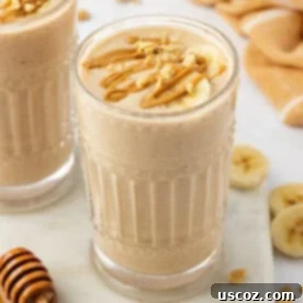 Sip into Summer: 11 Refreshing Smoothie Recipes 9 A wholesome peanut butter banana smoothie, drizzled with creamy peanut butter and topped with crunchy peanuts.