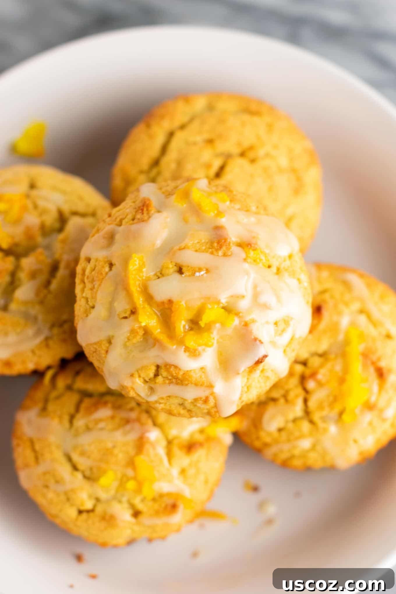 Zesty Gluten Free Orange Muffins 3 Close-up of the moist interior texture of a gluten-free orange muffin with glaze