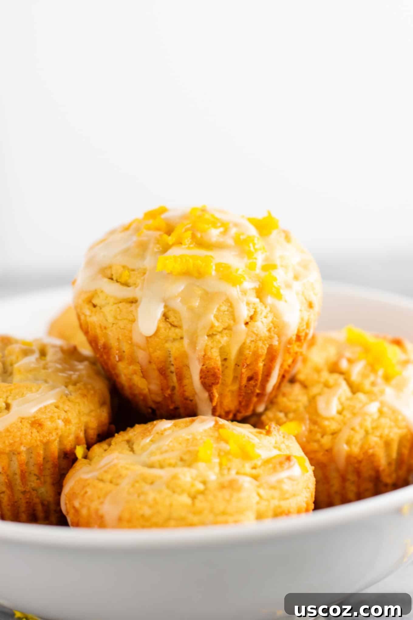 Zesty Gluten Free Orange Muffins 5 A close-up shot of a single gluten-free orange muffin, ready to be enjoyed