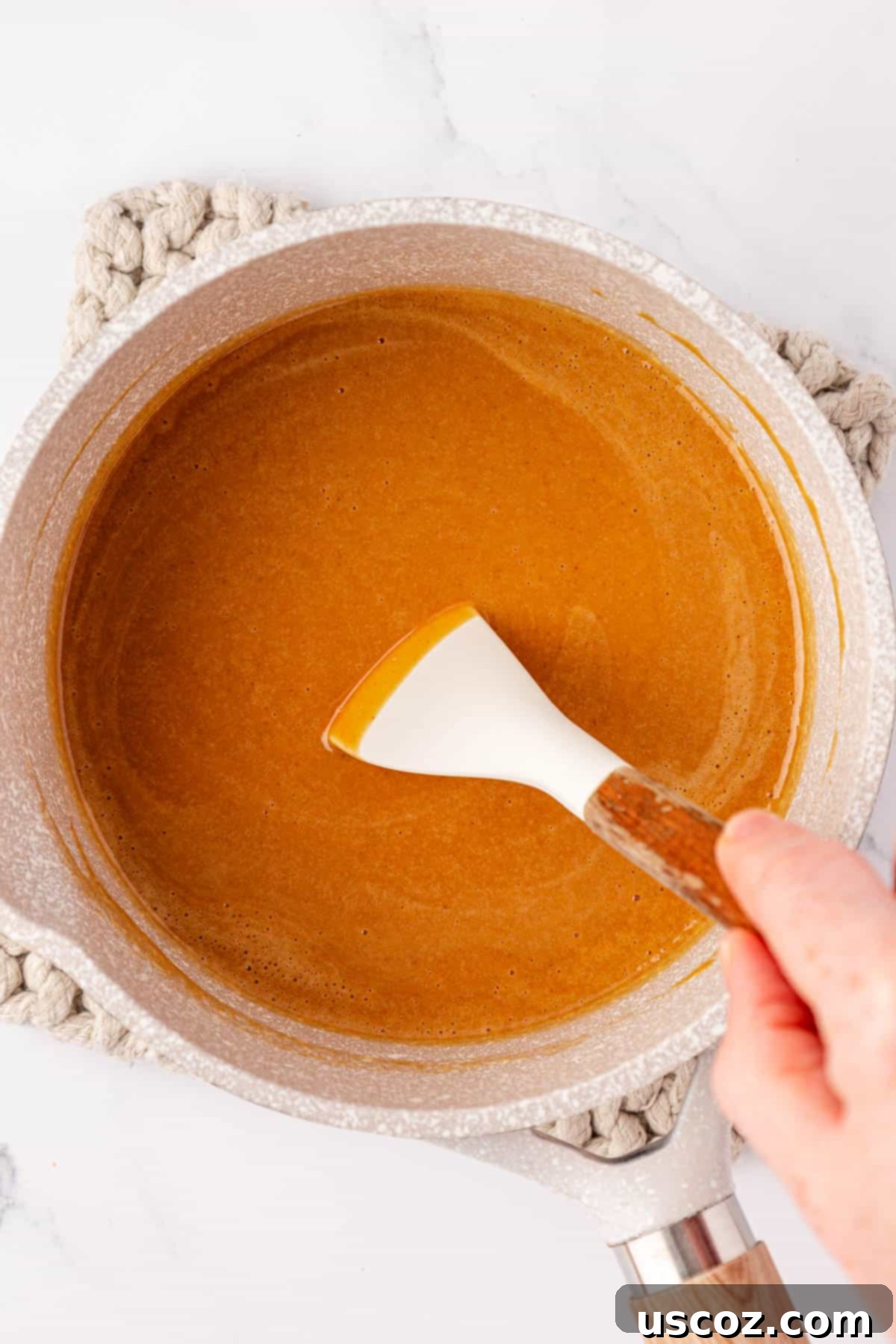 Wholesome No Bake Delights 6 Mixing the melted peanut butter, maple syrup, coconut oil, and salt together in a saucepan