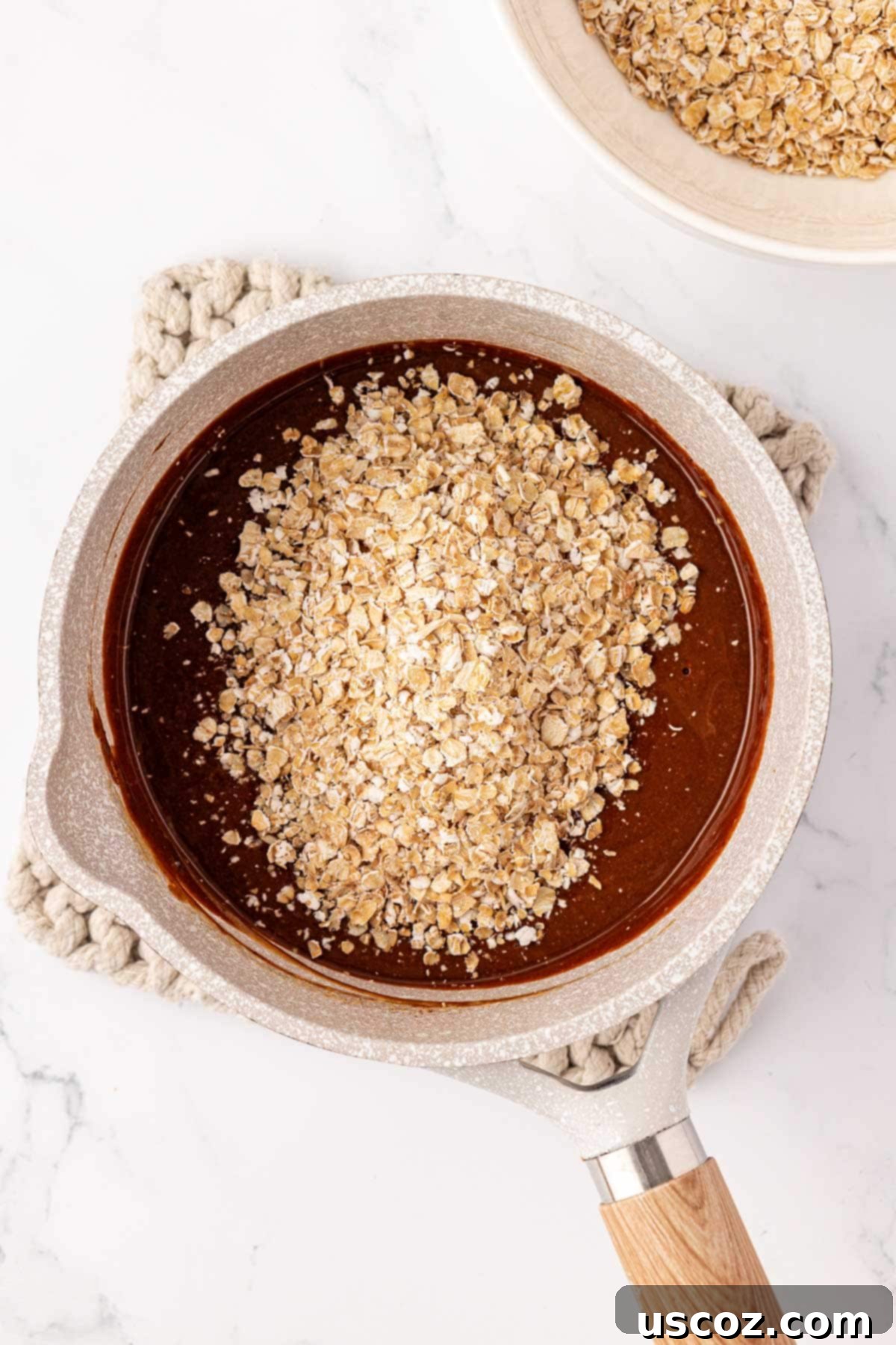 Wholesome No Bake Delights 10 Adding quick oats to the chocolate peanut butter mixture