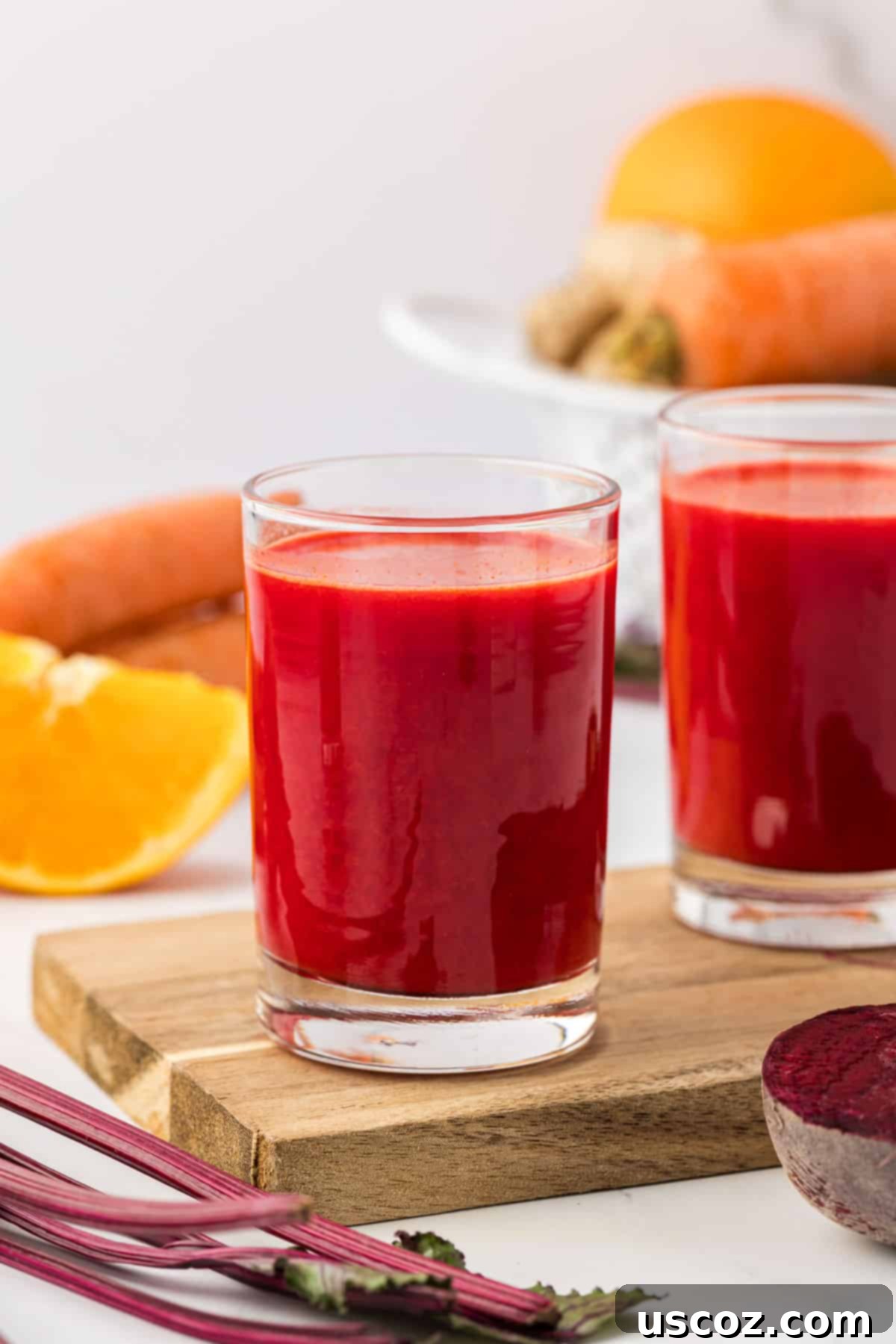 Ruby Root Refresher 2 A vibrant glass of fresh beet and carrot juice, ready to be enjoyed