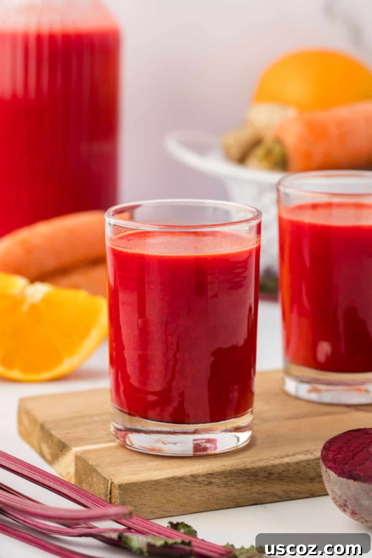 Ruby Root Refresher 13 A close-up shot of beet and carrot juice in a glass, highlighting its rich color