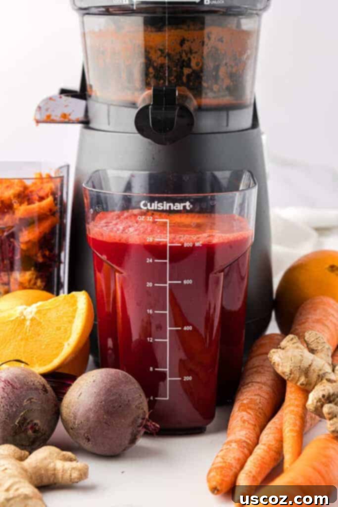Ruby Root Refresher 6 Freshly juiced beet and carrot juice in a juicing canister