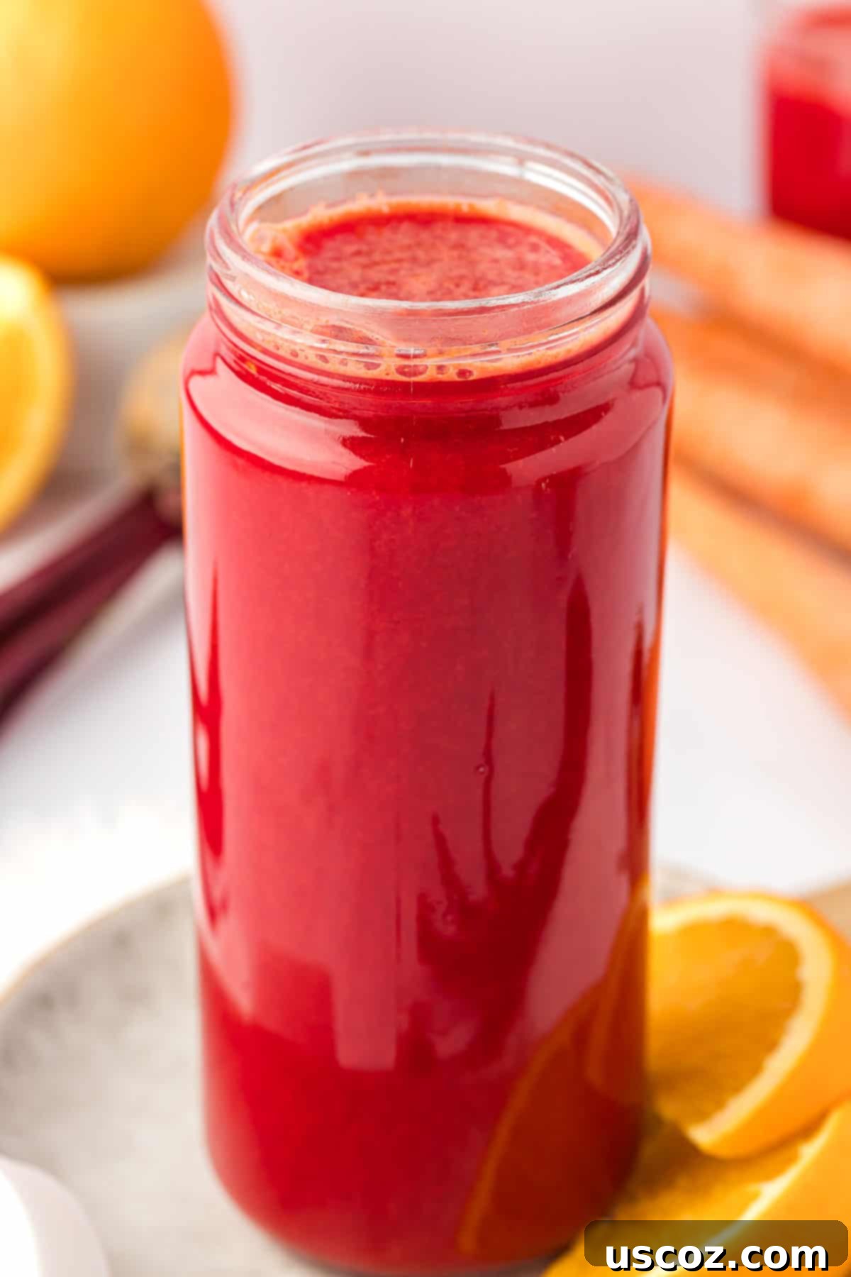 Ruby Root Refresher 9 Fresh beet and carrot juice stored in a glass container with a lid