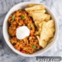 Tofu Mexican Rice Casserole Recipe with bell peppers and mushrooms. Scrambled tofu adds extra protein to this delicious vegetarian take on a healthier Mexican rice casserole. Serve with chips and sour cream! #tofumexicanrice #mexicanricecasserole #healthymexicanrice #tofu #vegetarian #dinner