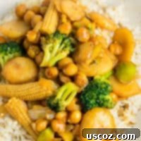 Vegan chickpea stirfry bowl with baby corn and water chestnuts