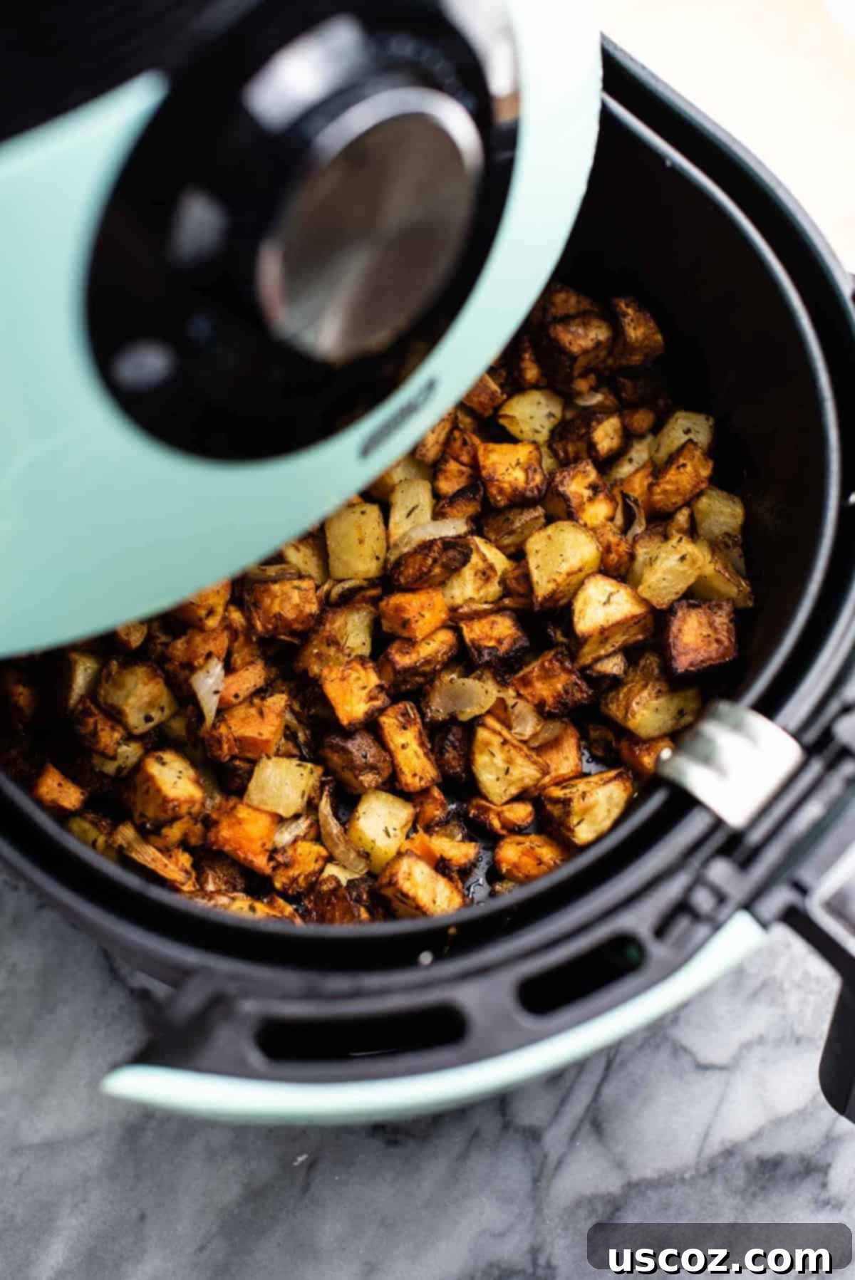 Crispy Air Fryer Breakfast Potatoes 2 Crispy air fryer breakfast potatoes with russet and sweet potatoes and onion