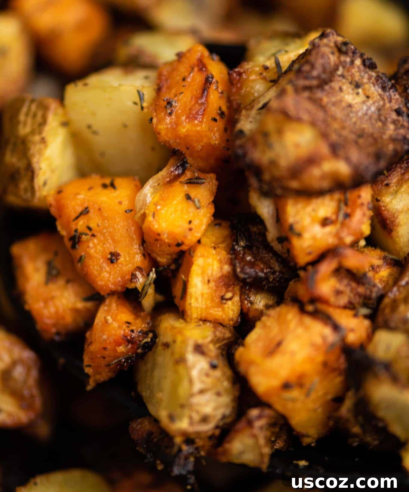 Crispy Air Fryer Breakfast Potatoes 3 Diced sweet potatoes, russet potatoes, and yellow onion ready for the air fryer